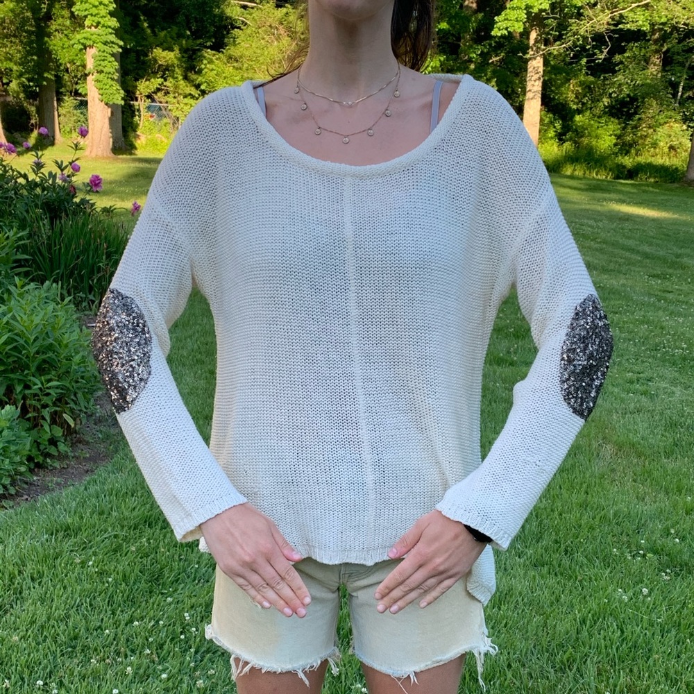Sweater with sequined elbow patches